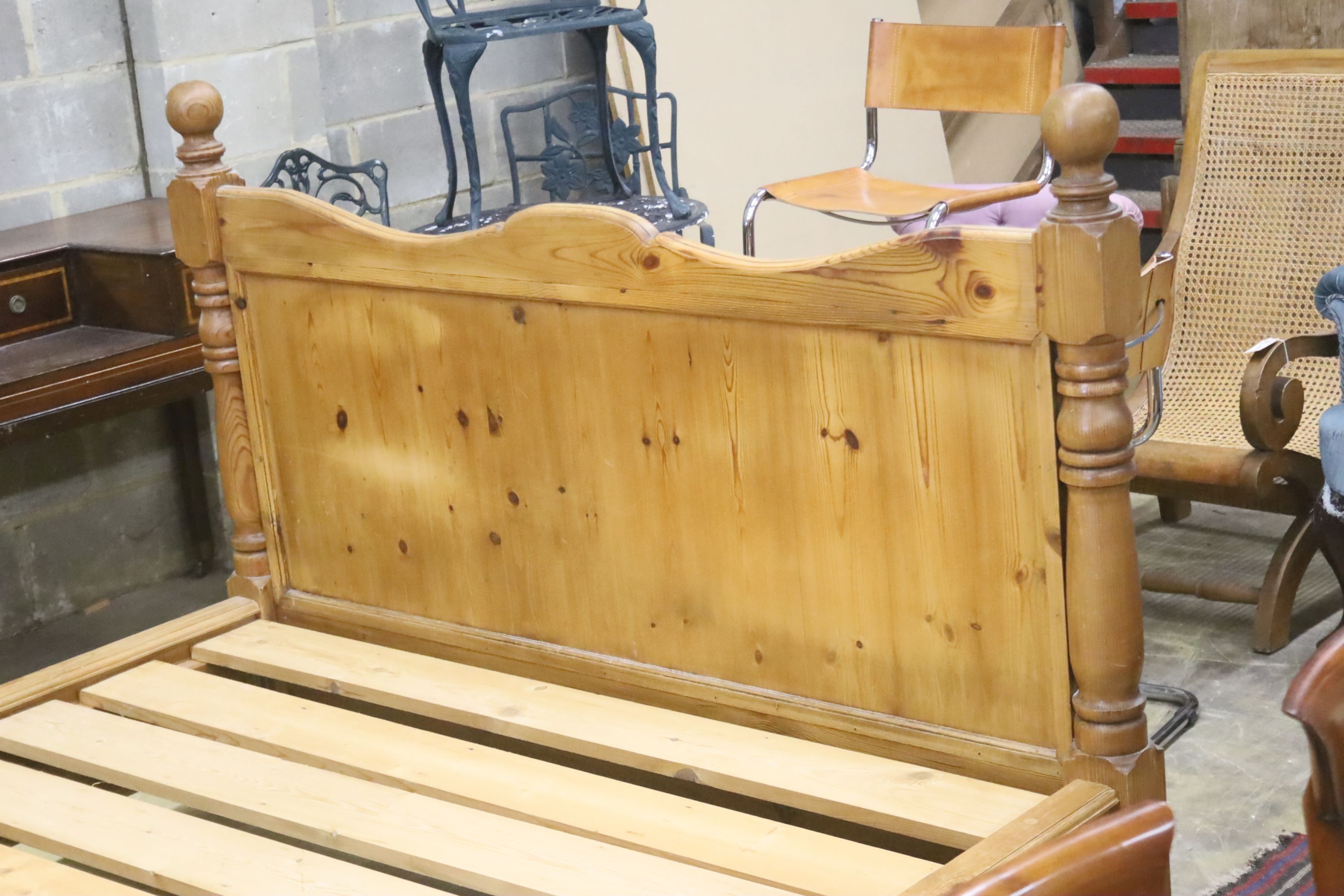 A king size pine bed frame with side rails and slats, width 170cm, length 213cm